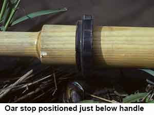Oar stop positioned just below handle