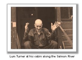 Lum in front of his cabin along the Salmon