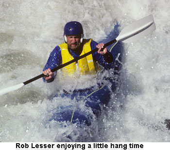 Kayaker surfing a hole